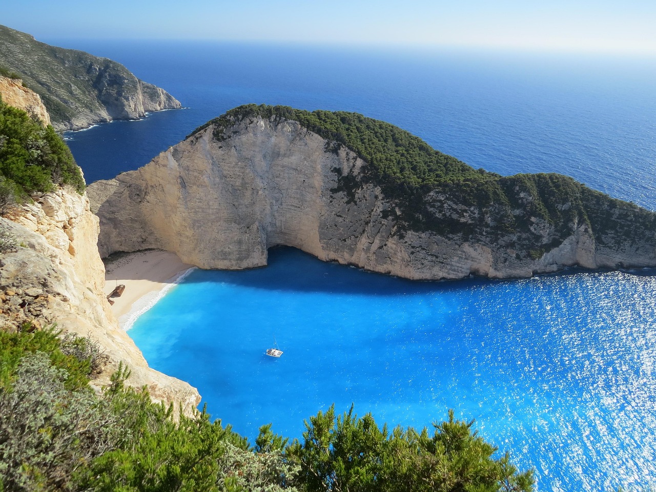 A turquoise bay surrounded by limestone cliffs near Corfu Greece