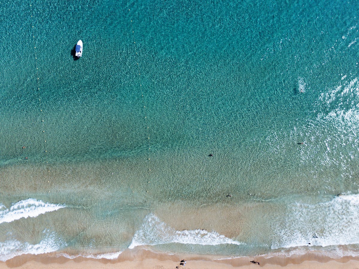 Aerial view of Glyfada Beach in Corfu with sandy shores and turquoise water