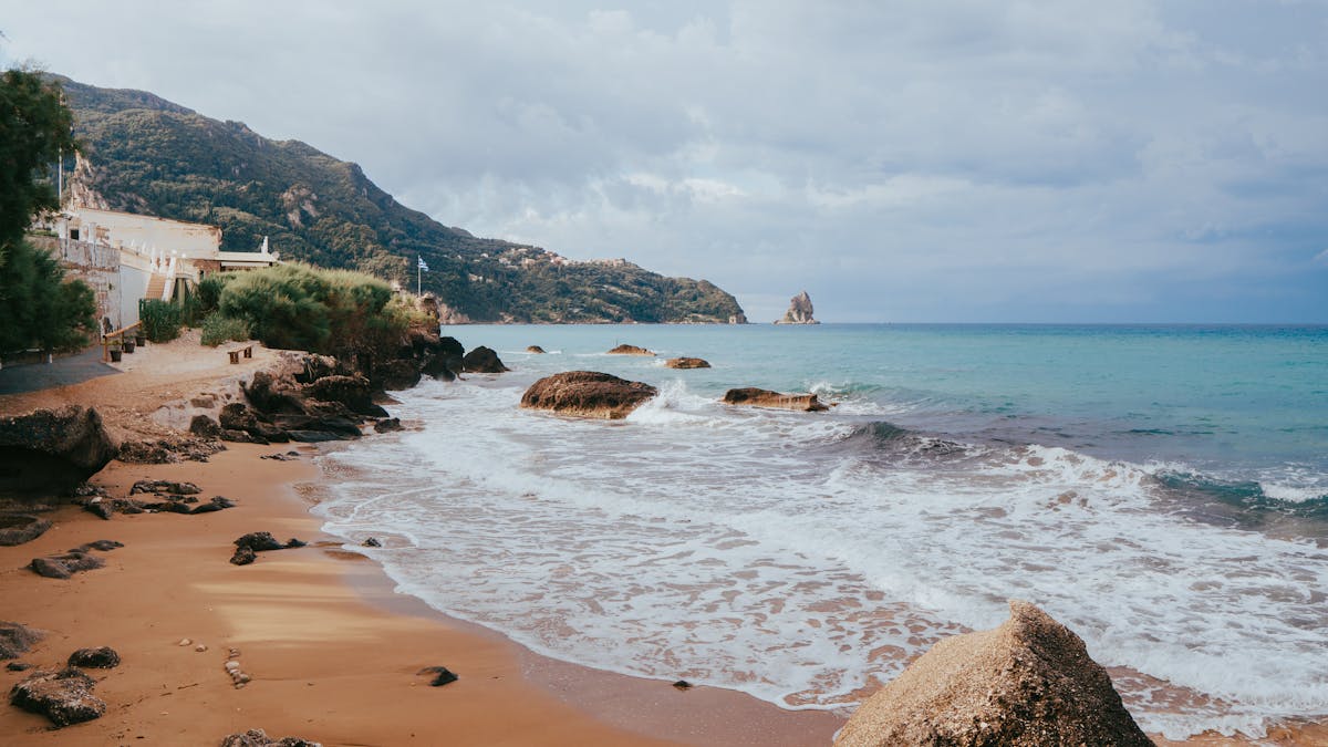 Sandy beach with turquoise sea on Corfu Island Greece