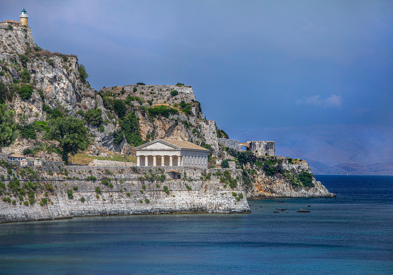 The lush green coast of Corfu island meeting the deep blue Ionian Sea