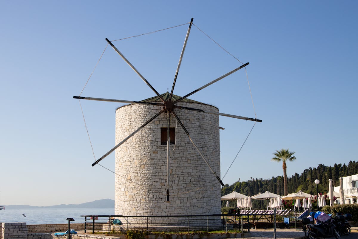 Classic Greek windmill on Corfu coastline with sea views