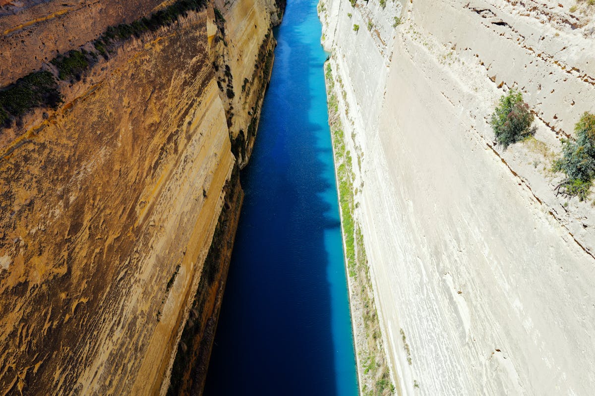 Stunning aerial photograph of the Corinth Canal slicing through rocky cliffs in Greece