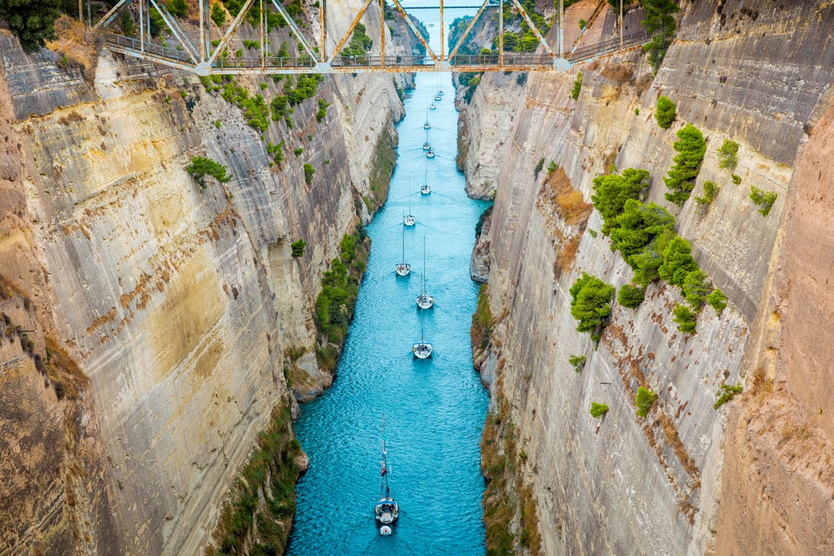 Luxury yachts passing through the narrow Corinth Canal in Greece