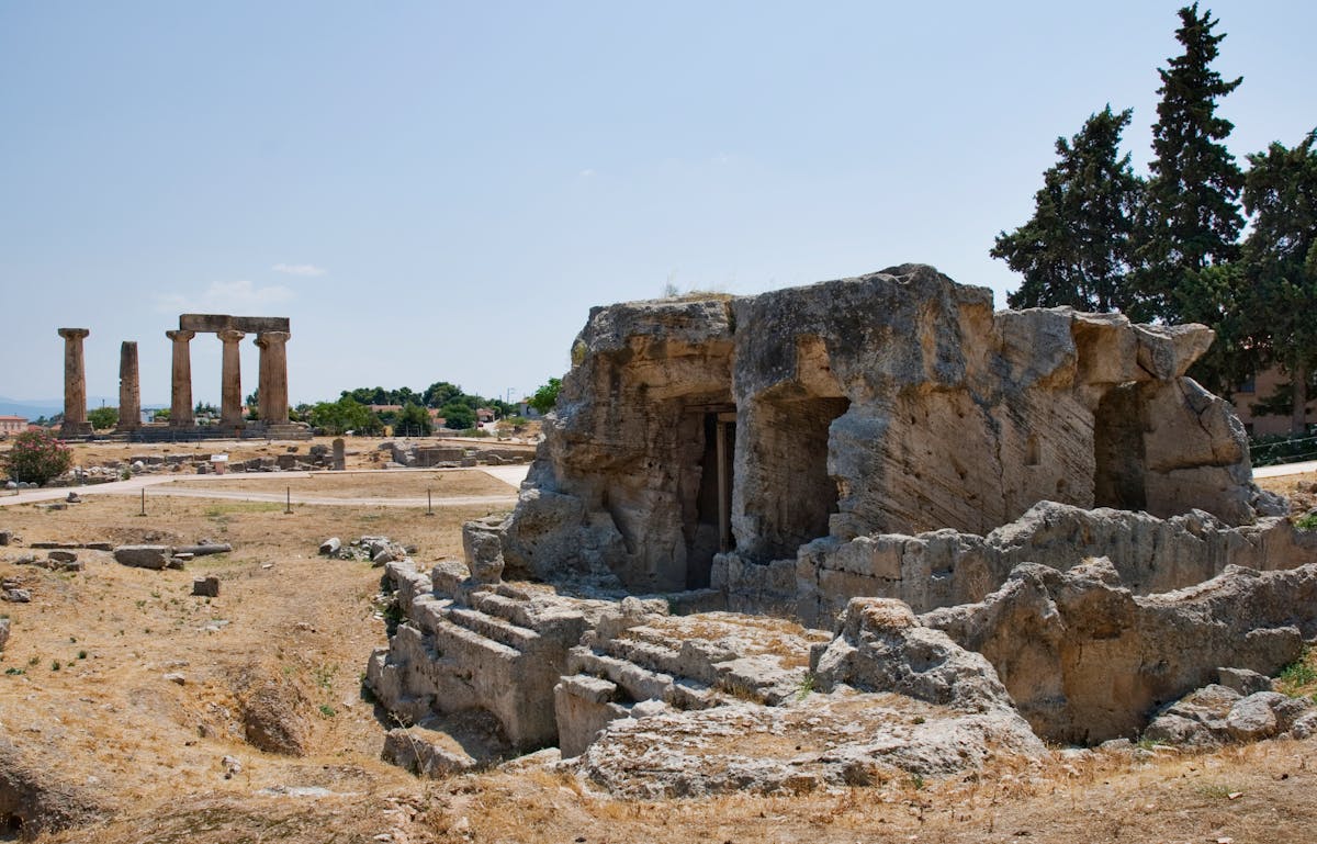 Rows of ancient stone pillars and ruins at Corinth archaeological site in Greece
