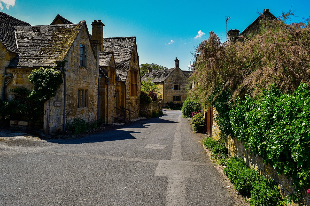 Stone cottages along the River Windrush in Bourton-on-the-Water Cotswolds
