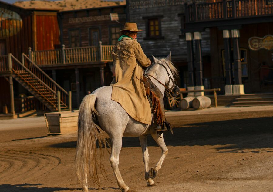 Cowboy riding a white horse at Mini Hollywood theme park in Tabernas