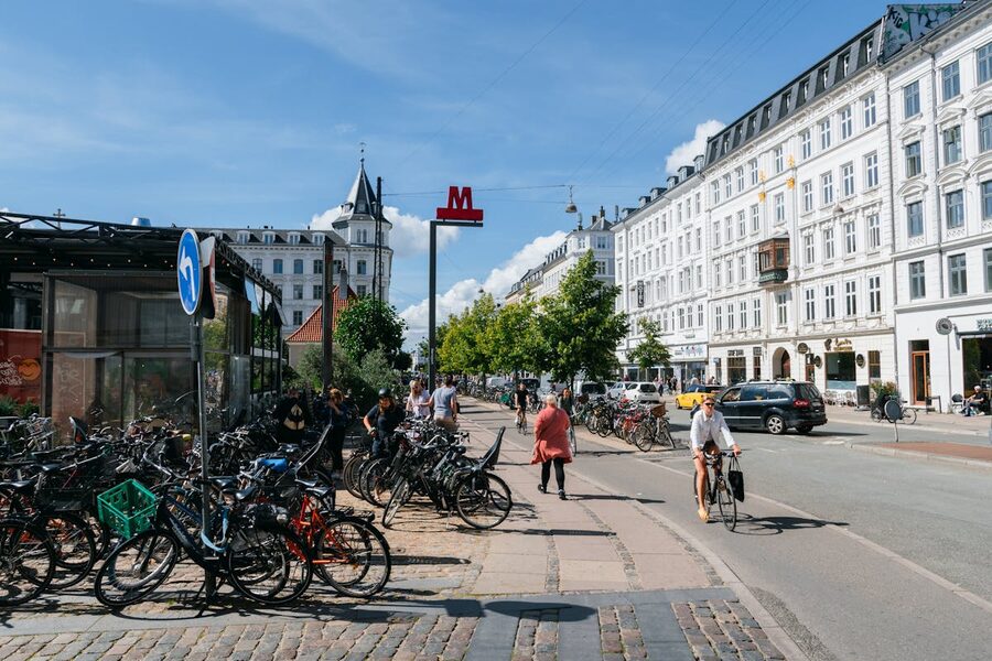Cyclists and pedestrians in a Copenhagen street showing urban bike life