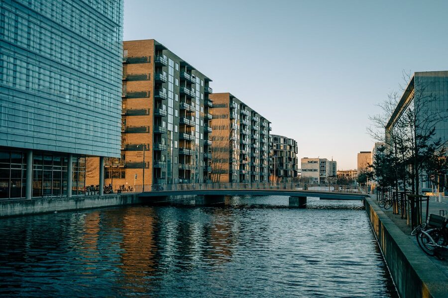 Copenhagen urban canal with modern architecture and reflections in daylight