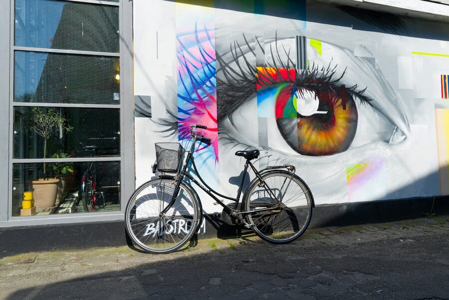 Colorful street art mural with bicycle in Copenhagen