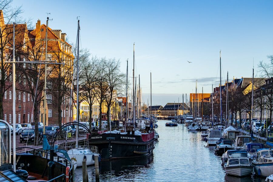Colorful canal with boats in Christianshavn Copenhagen on a sunny winter day