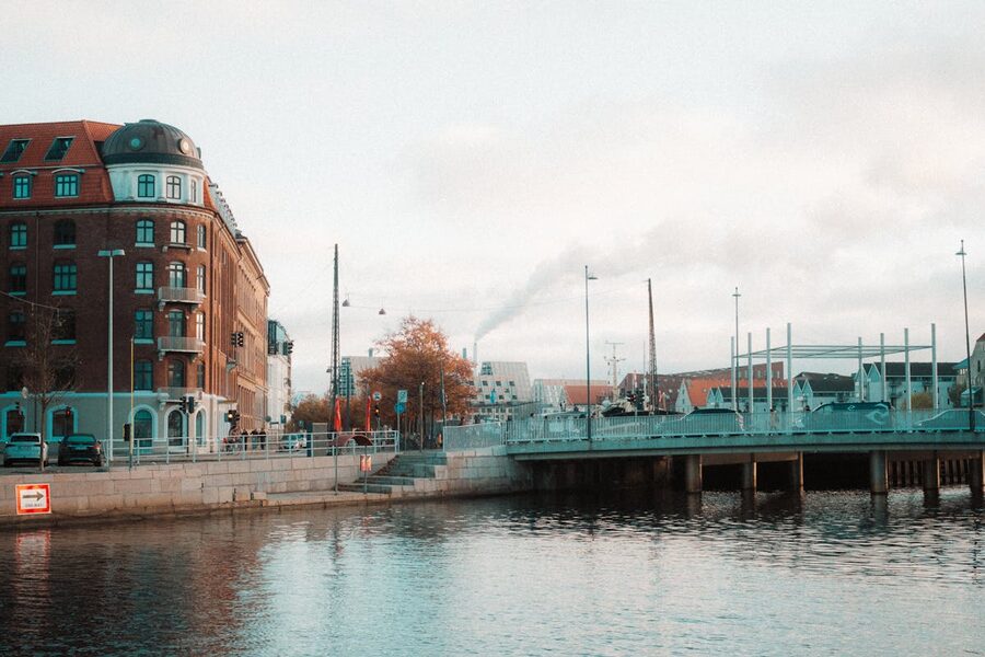 Historic buildings and bridge over calm water in Copenhagen