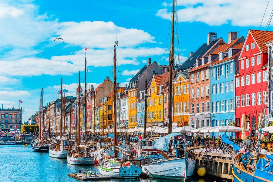 Colorful houses and boats at Nyhavn port Copenhagen Denmark
