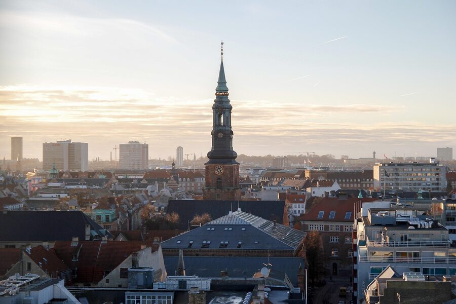 Copenhagen Denmark skyline showing churches and the Round Tower at sunset