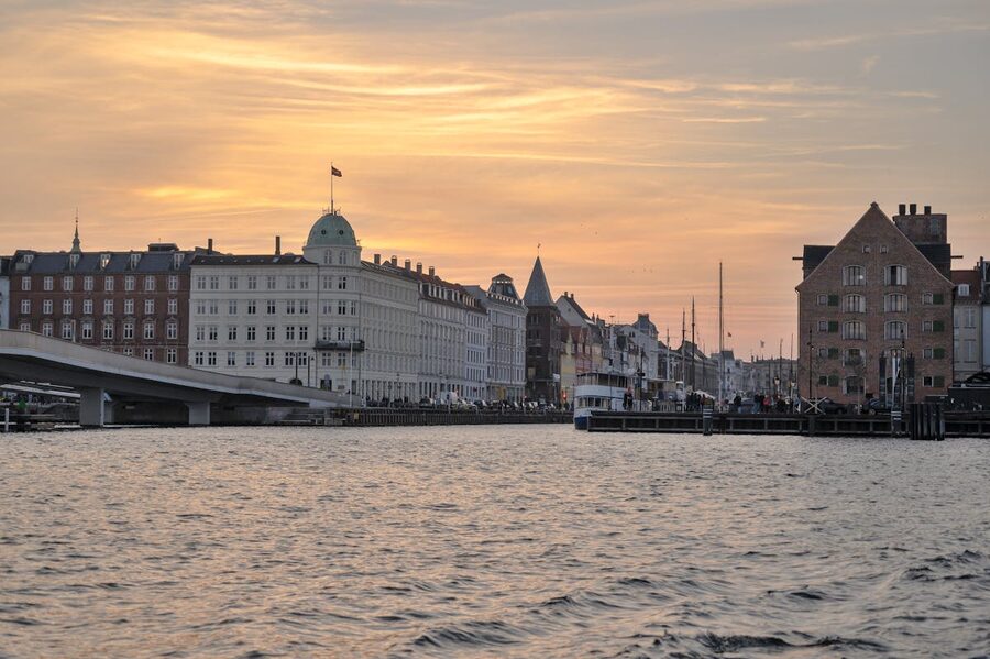 Copenhagen waterfront buildings during twilight with historic architecture and river