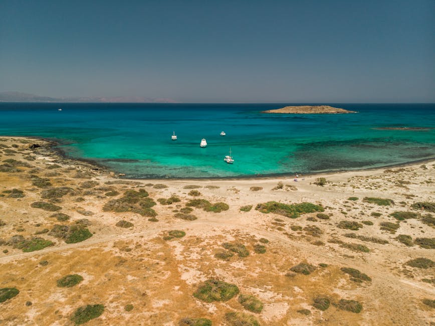 Crete turquoise beach with anchored boat