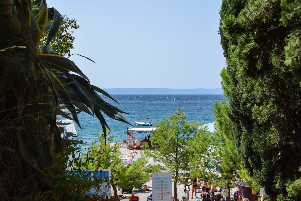Makarska beach in Croatia surrounded by lush greenery