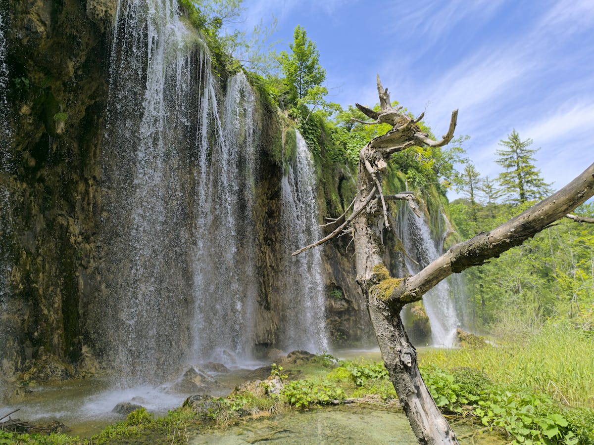Waterfall cascading over rocks in Plitvice Lakes National Park