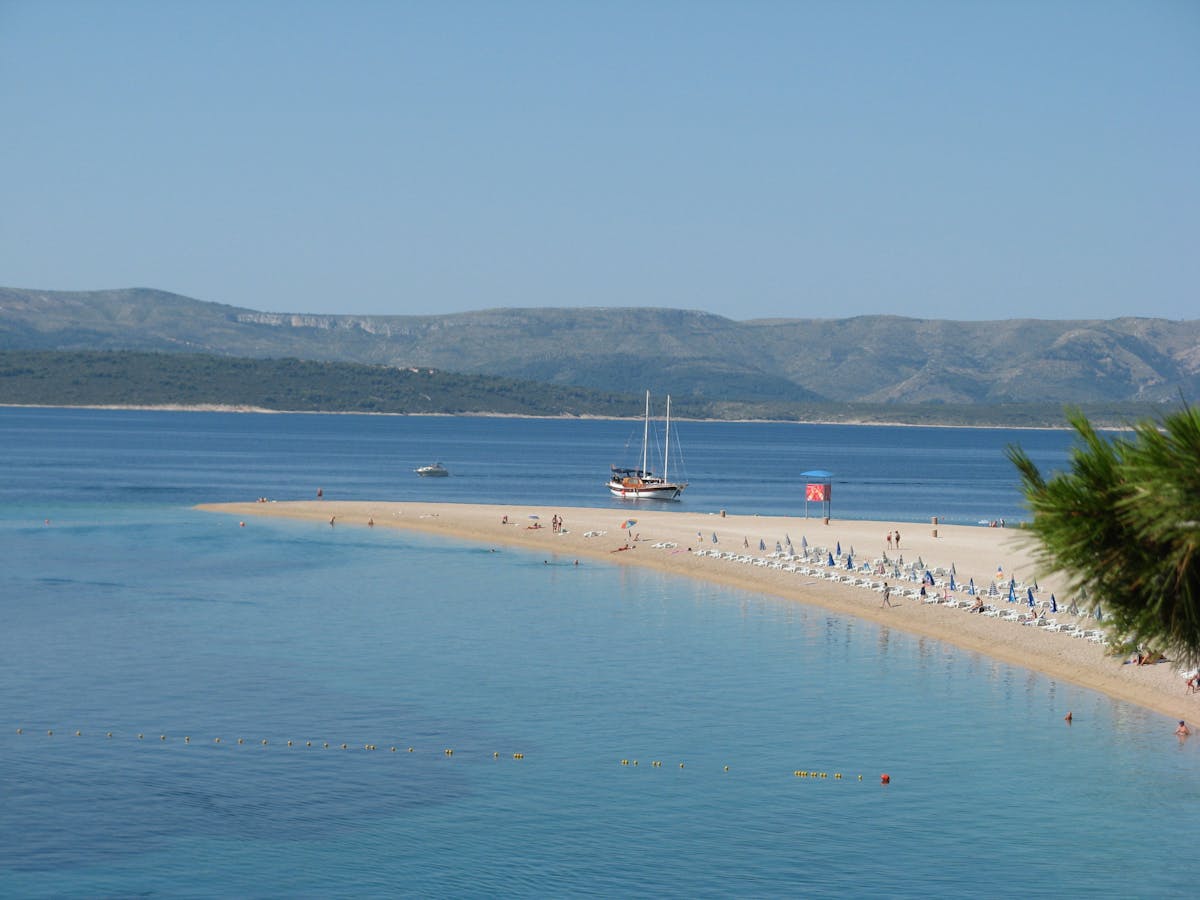 Panoramic view of Zlatni Rat Beach in Croatia with clear turquoise waters