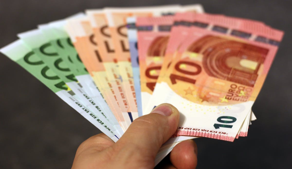 Euro banknotes held in a hand