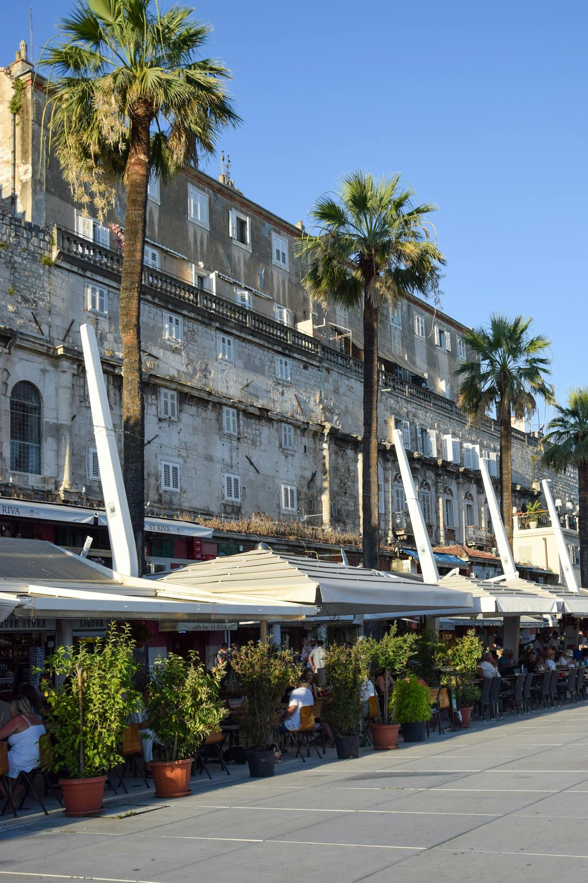 Outdoor cafes and historic buildings in Split, Croatia