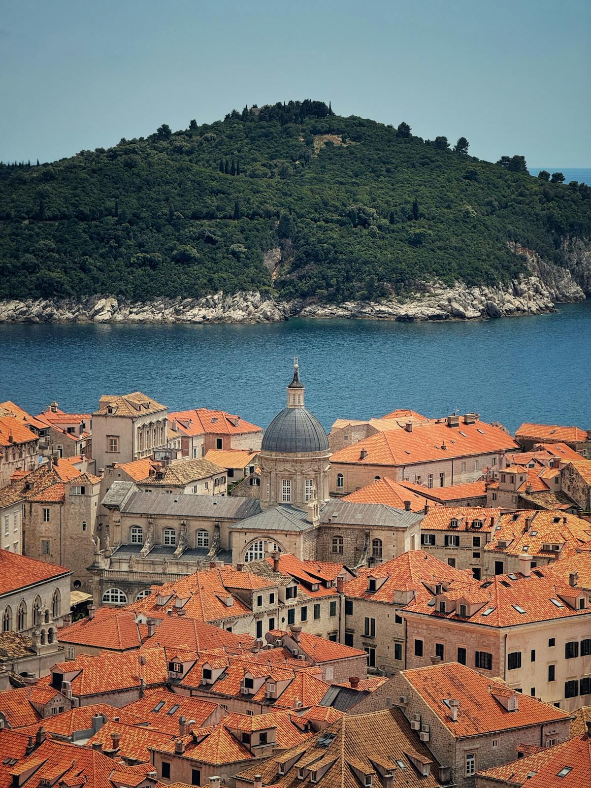 Aerial view of Dubrovnik's old town with terracotta roofs and sea