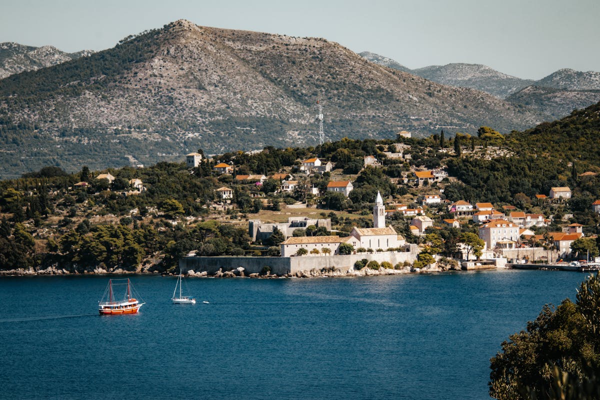 Croatian harbour with boats moored in clear water