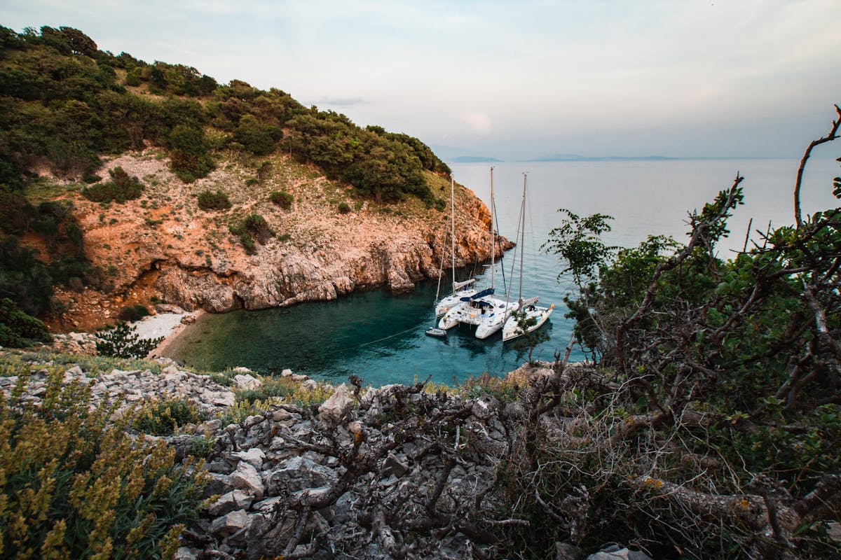 Yachts anchored in a cove near Punat, Croatia surrounded by cliffs