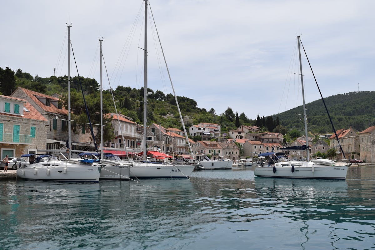 Harbour in Croatia with sailboats and waterfront buildings