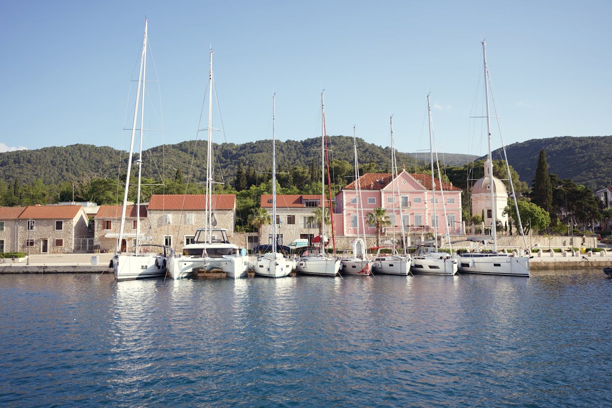 Yachts docked at the colourful waterfront of Stari Grad, Croatia