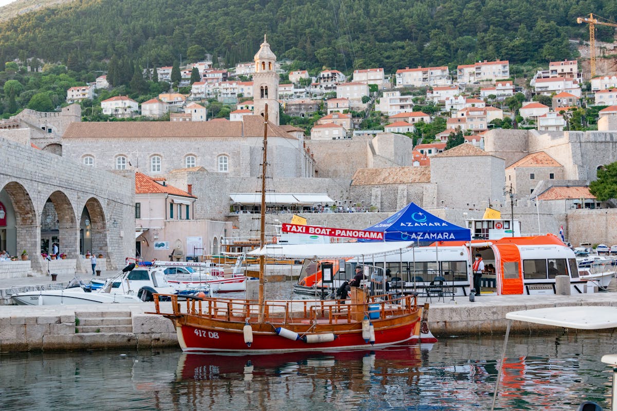 Wooden boats docked at Dubrovnik old town harbour