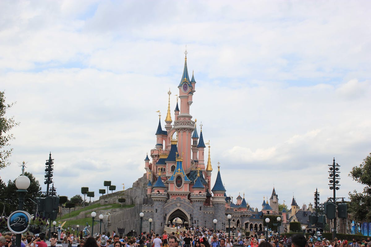 Crowds gathered around Sleeping Beauty Castle at Disneyland Paris