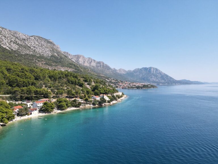 Aerial turquoise coastline mountains Dalmatia
