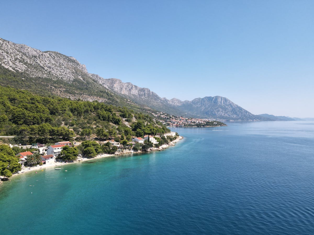 Aerial turquoise coastline mountains Dalmatia