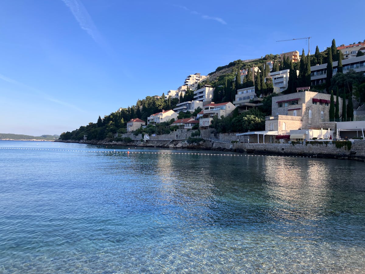 Dubrovnik coastline with clear water and hillside homes