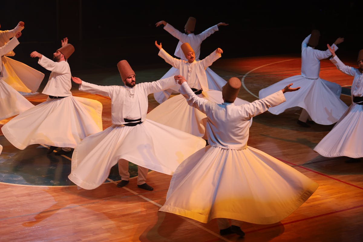 Group of whirling dervishes performing together