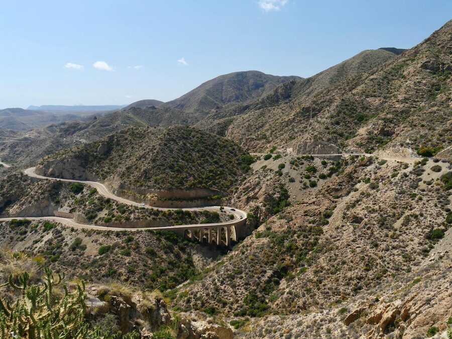 Winding mountain road through Spanish desert landscape