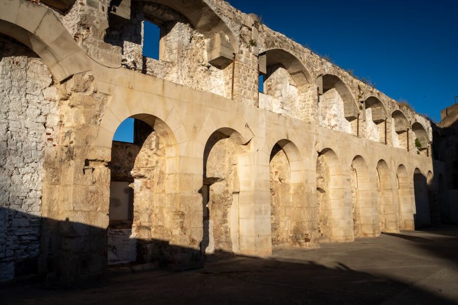 Sunlit Roman ruins Split Croatia historic arches