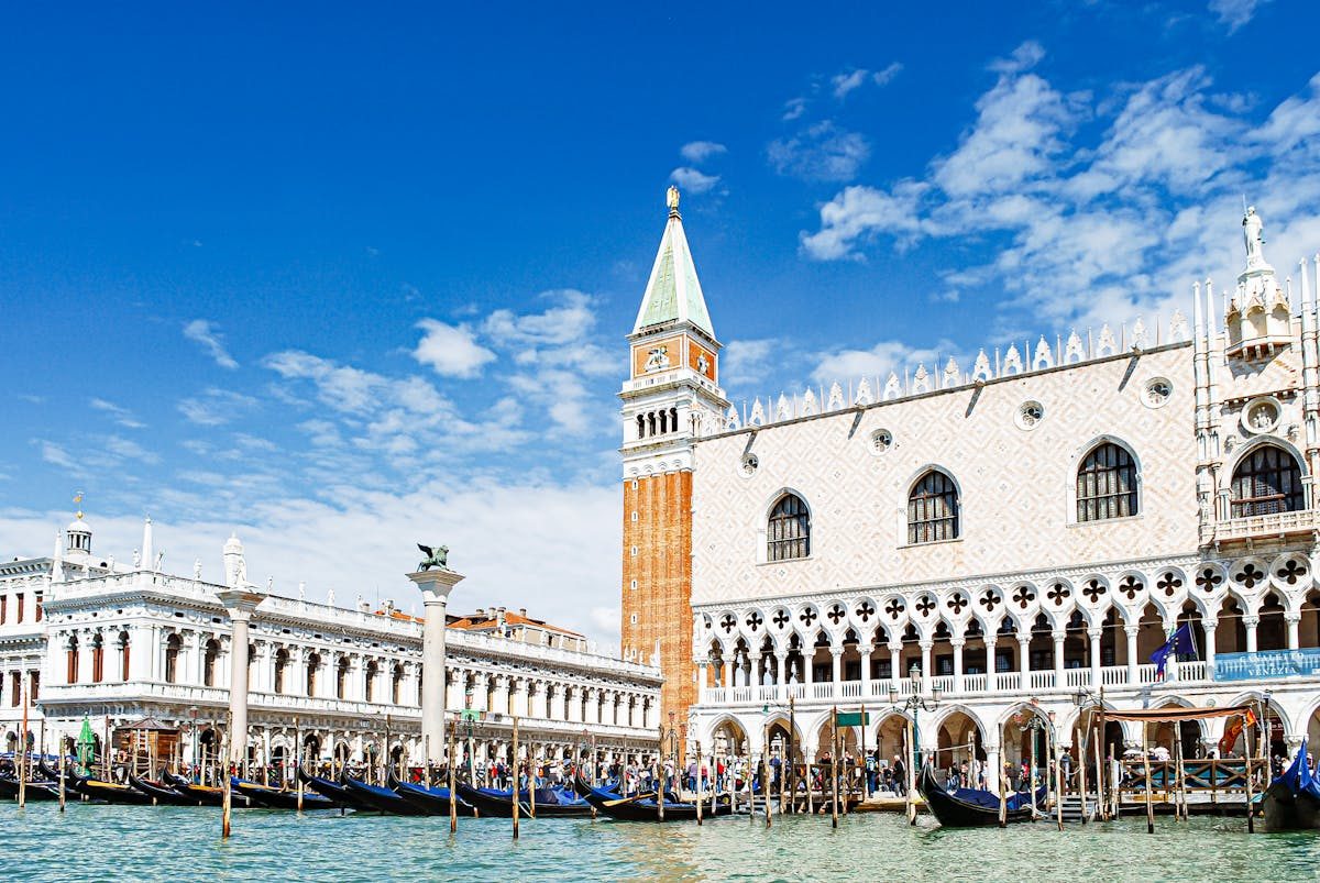 Gondolas moored in front of Doges Palace and St Marks Campanile Venice