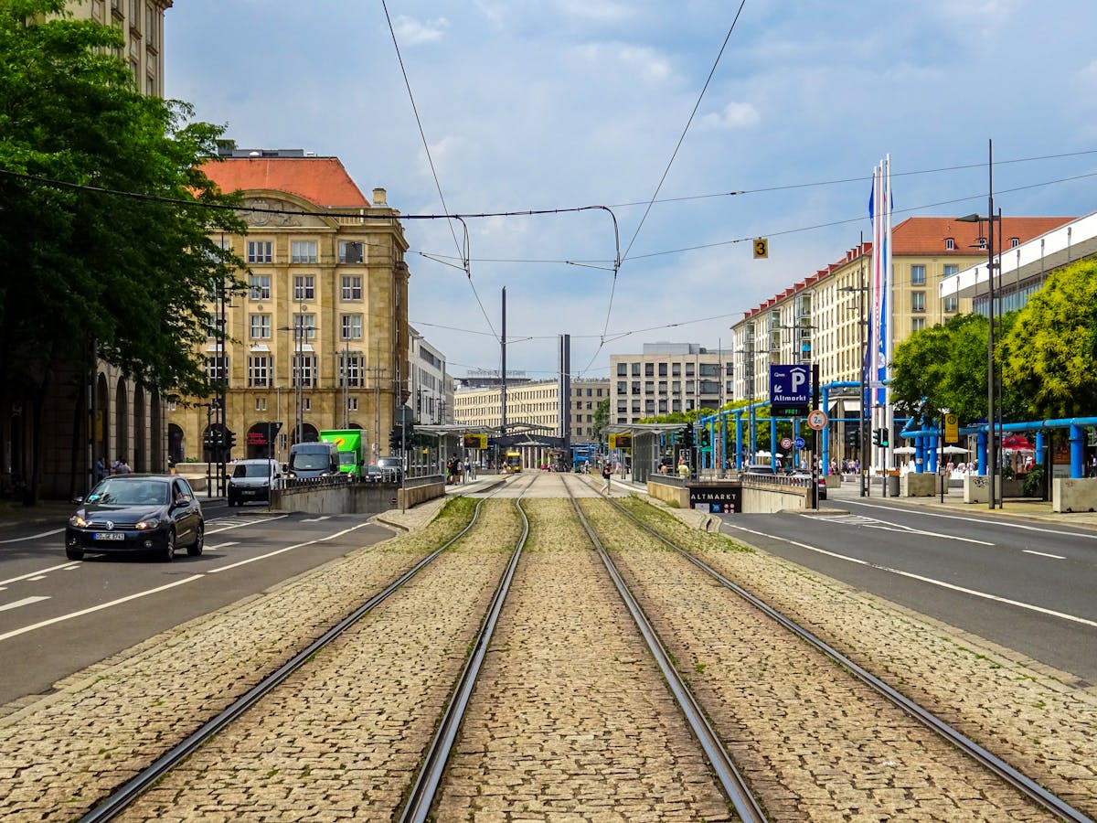 Cobblestone tram tracks through Dresden city center with historic architecture