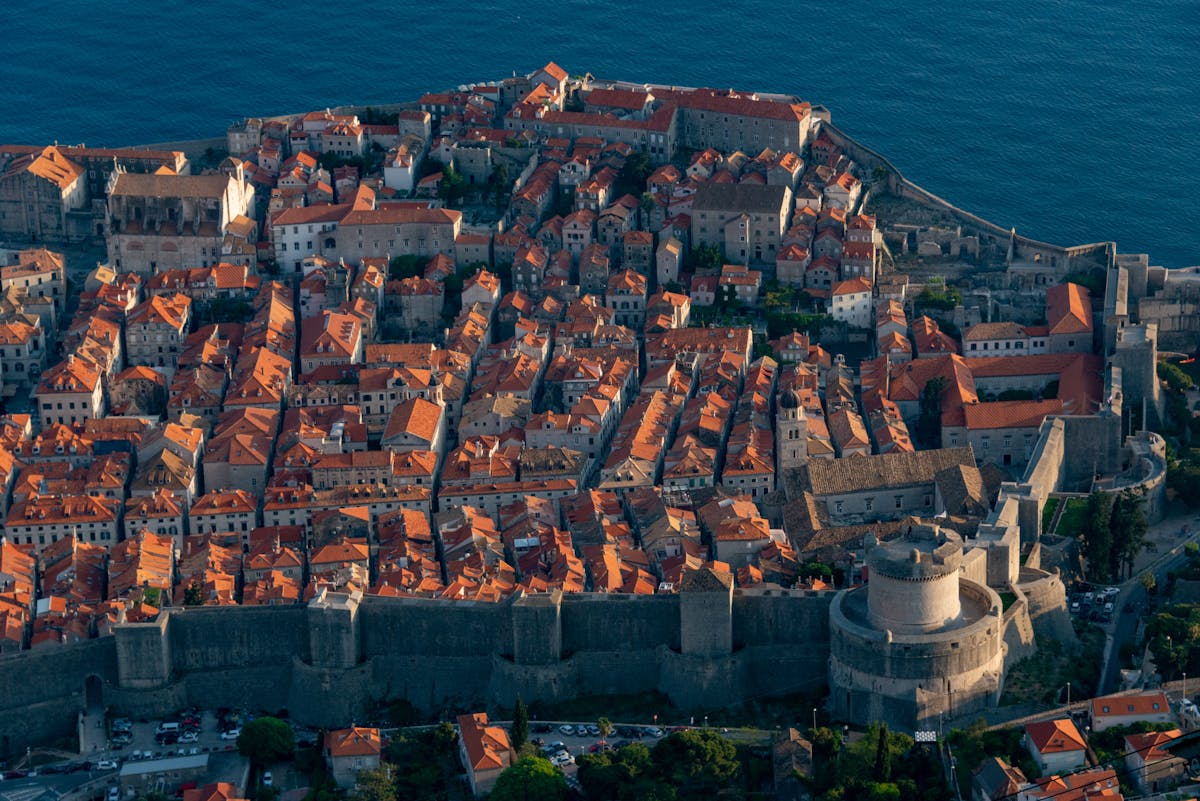 Aerial view of Dubrovnik historic Old Town with ancient city walls and red-tiled roofs