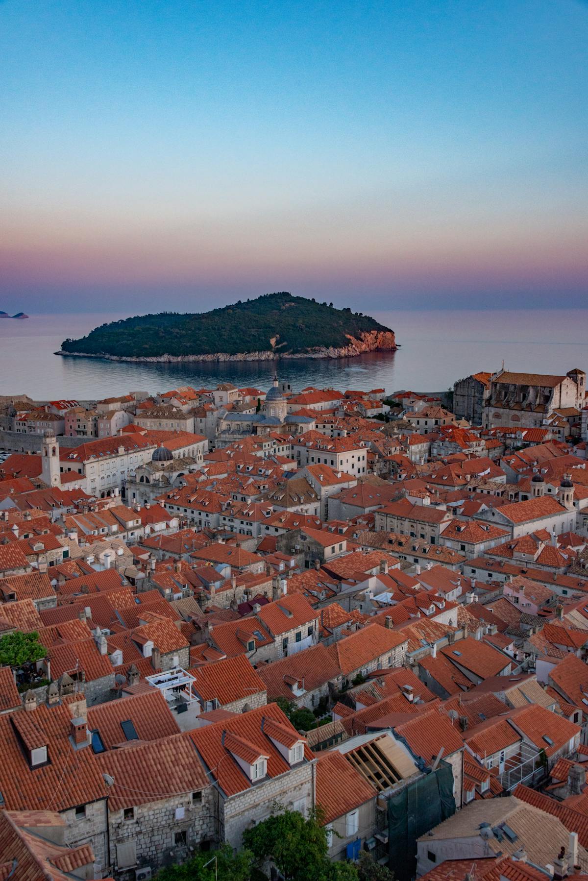 Aerial view of Dubrovnik's Old Town and Lokrum Island at sunset