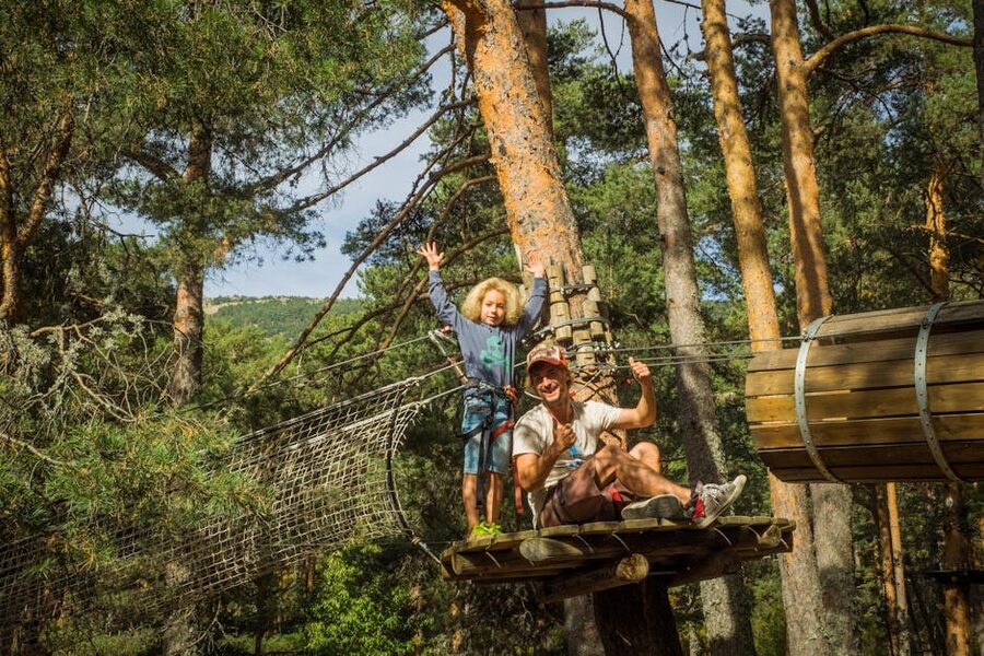 Father and child forest zipline adventure