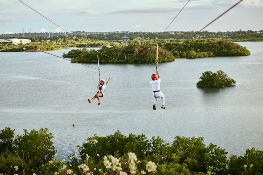 Zipline ride over scenic water landscape