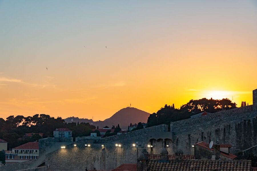 Dubrovnik ancient walls at sunset silhouette