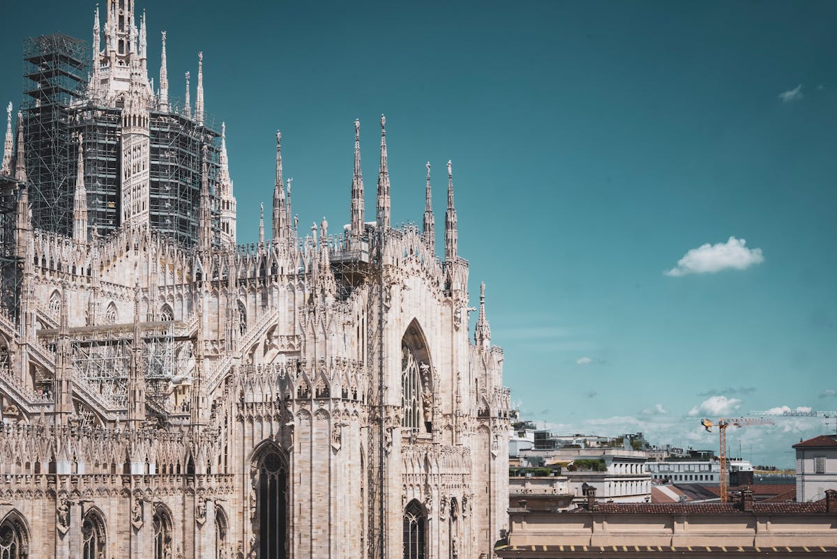 Close-up of Milan Cathedral spires and Gothic architecture