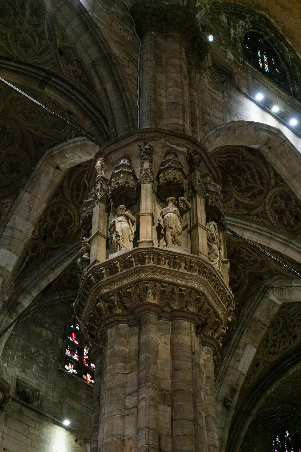Colorful stained glass windows inside Milan Duomo