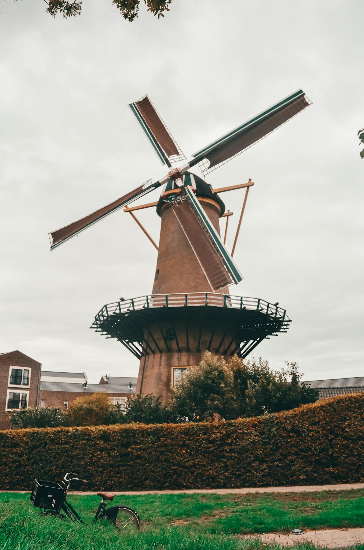 Dutch windmill with bicycle parked in the foreground