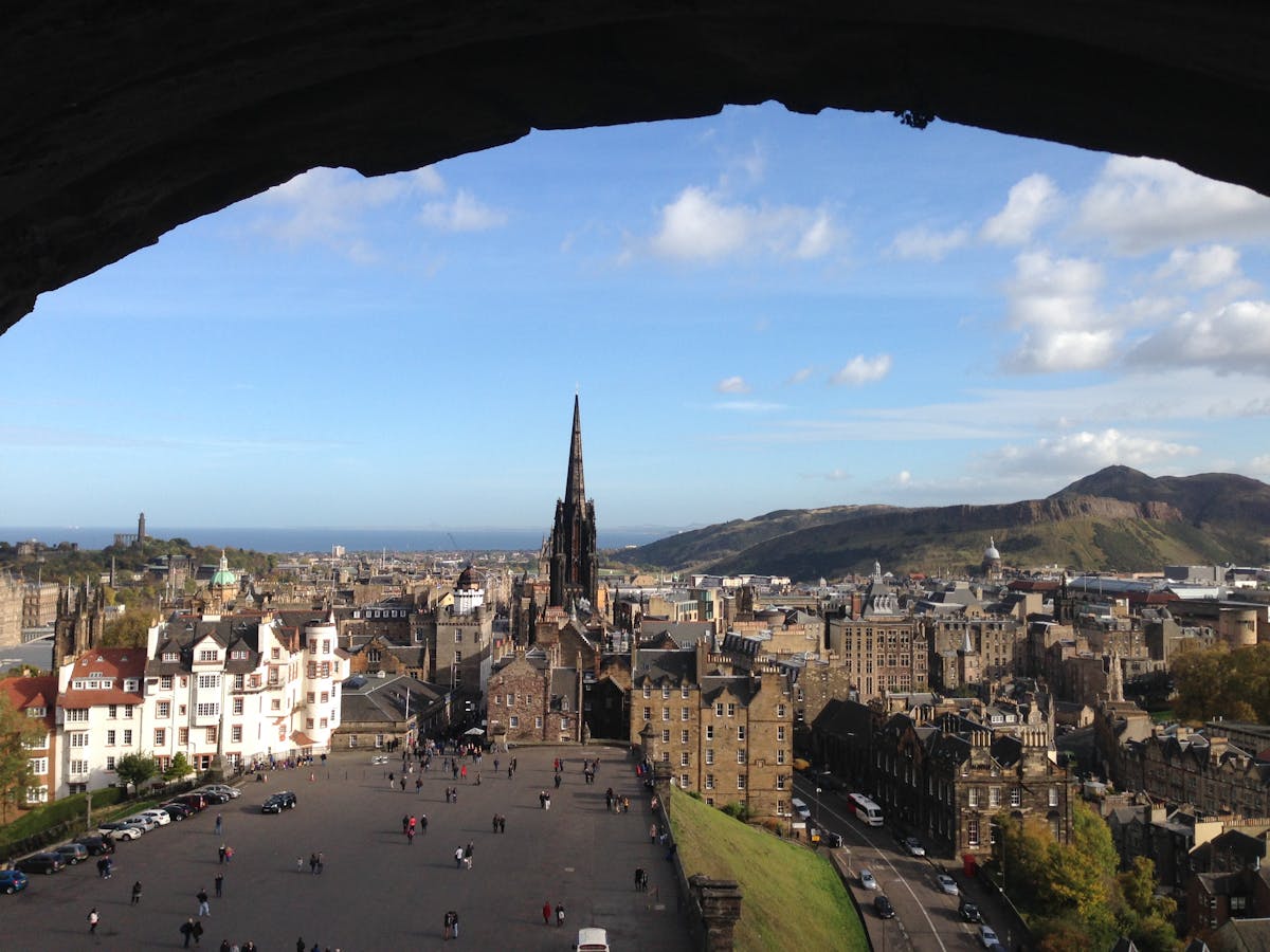 Edinburgh skyline with historic buildings and hills at sunrise