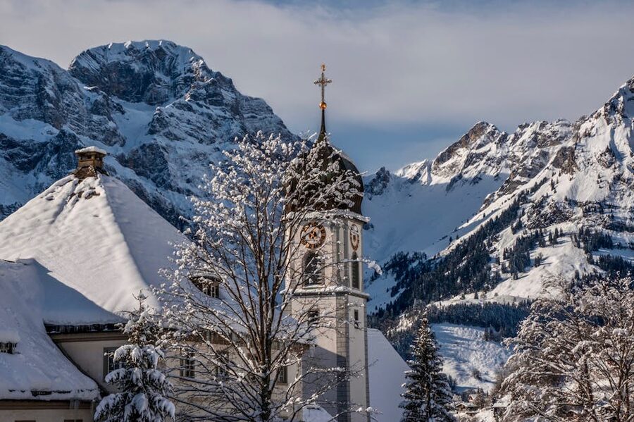 Engelberg monastery church near snowy mountains