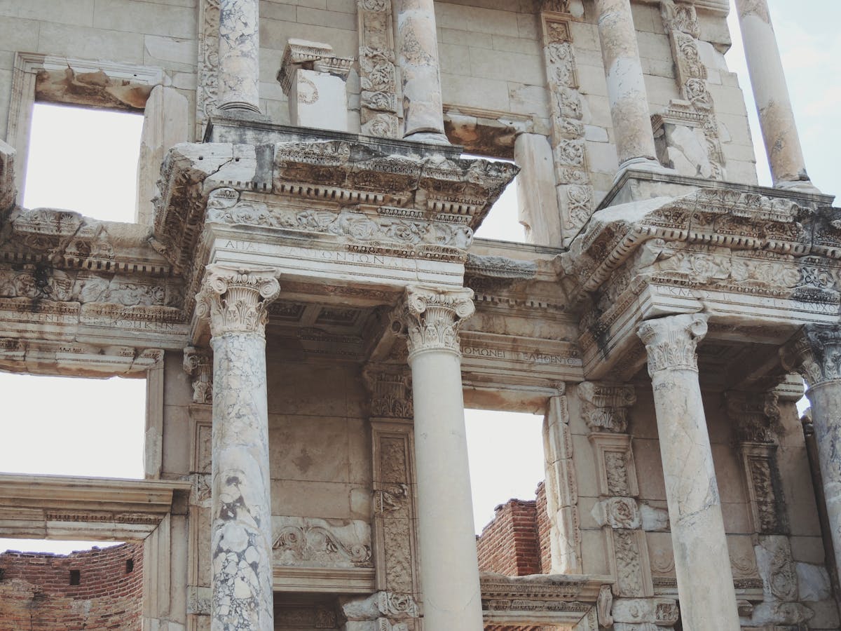 Detailed view of ancient Roman architectural ruins at Ephesus showing carved stone and columns